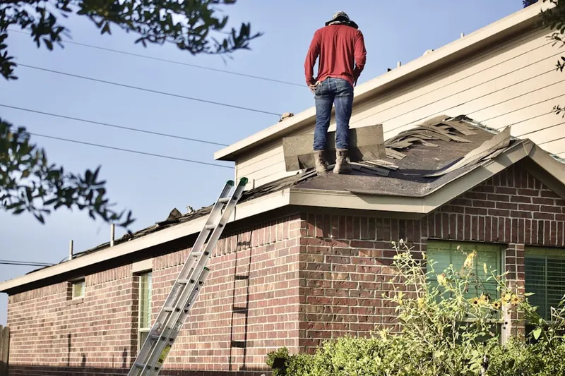 Professional roofer working on a residential roof in Rolling Meadows